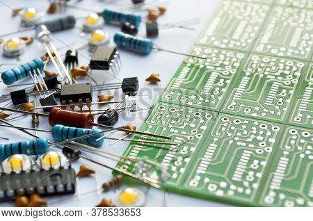 Different Electronic Components And Green Electronic Circuit Board Close-up. Shallow Depth Of Field,