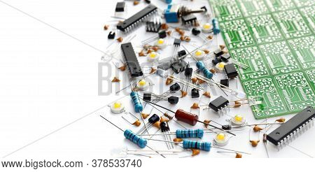 Various Electronic Components Arranged Near Green Electronic Circuit Board On White Background With 