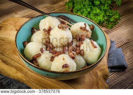 Meat Stuffed Potato Dumplings With Fried Onion And Greaves.