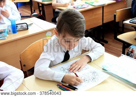 Moscow, Russia - September 1, 2017: Schoolboy, Pupil Sitting At The Desk In Class At School, Traditi