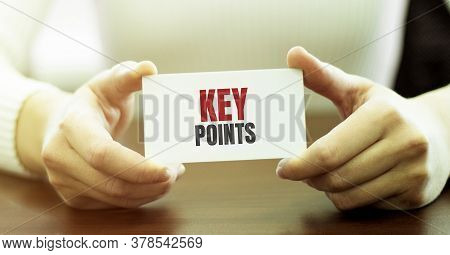 Businesswoman Showing Card With Text Key Points In The Modern Office