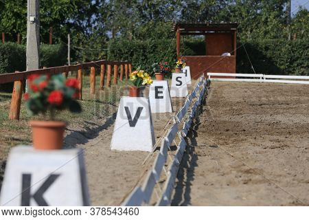 Image Of Poles On Empty Training Field. Wooden Barriers For Horses As A Background. Colorful Photo O