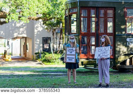New Orleans, Louisiana/usa - 6/12/2020: Demonstrators For Black Lives Matter Stand In Front Of Passi