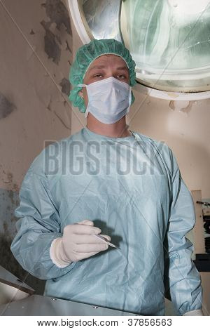 Surgeon standing very calmy before coming difficult surgery