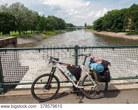 July 20th 2020, Podebrady, Czechia. Heavy Loaded Mtb On The Bridge Over Elbe River In Podebrady