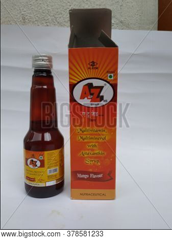 Closeup Of A To Z Ns Multi Vitamin And Mineral, Mango Flavour 200 Ml Syrup Bottle And Pack Isolated