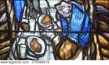 PIFLAS, GERMANY - JUNE 07, 2015: Spirit of God awakens a new life, both dead and alive, detail of stained glass window by Sieger Koder in church of Saint John in Piflas, Germany