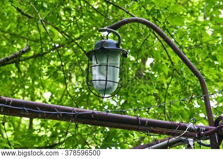 Street Lighting Hangs Over Barbed Wire. Genaral Plan.