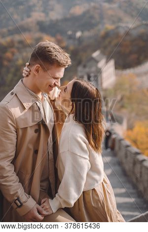 Beautiful Young Couple Showing Affection On The Great Wall Of China