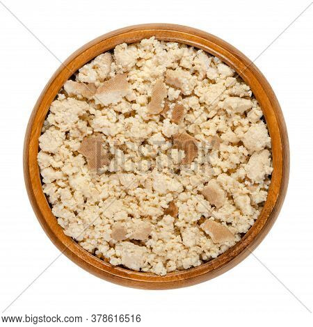 Smoked Tofu, Bean Curd, Crumbled By Hand, In A Wooden Bowl. Coagulated Soy Milk, A Component Of Asia