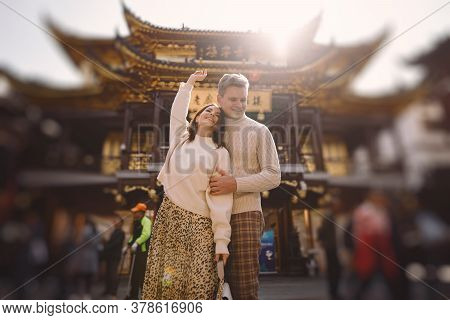 Newlywed Couple Showing Affection And Holding Hands In Shanghai Near Yuyuan While Visiting China