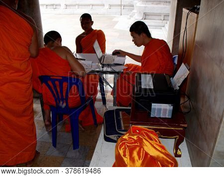 Bangkok, Thailand, September 22, 2015: Young Buddhist monks study using a computer at a temple in Bangkok, Thailand.