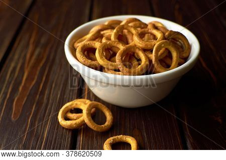 Bowl With Wheat Russian Bagles Over Dark Wooden Background