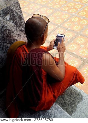 Chiang Mai, Thailand, May 25, 2017: Buddhist Monk Checks His Phone In Chiang Mai, Thailand.