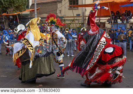 Oruro, Bolivia - February 25, 2017: Members Of A Waca Waca Dance Group In Ornate Costume Parade Thro