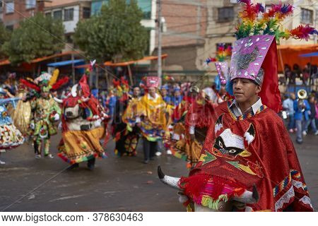 Oruro, Bolivia - February 25, 2017: Members Of A Waca Waca Dance Group In Ornate Costume Parade Thro