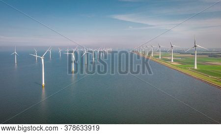 Windmill Park Westermeerdijk Netherlands, Wind Mill Turbine With Blue Sky In Ocean, Green Energy