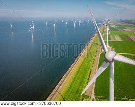 Windmill Park Westermeerdijk Netherlands, Wind Mill Turbine With Blue Sky In Ocean, Green Energy
