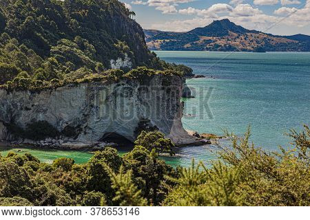 View Over Cliffy Shore Of Te Whanganui-a-hei Marine Reserve On Northern Island In New Zealand In Sum
