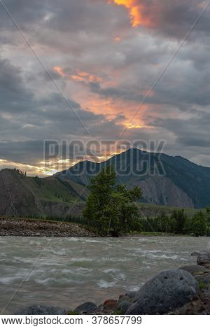 Sunset In The Altay Mountains. The Shore Of The Chuya River, Near The Village Of Chibit.