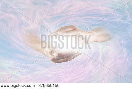 Working With Powerful Divine Energy - Male Hands Emerging From Blue Pink Rotating Energy Field Backg