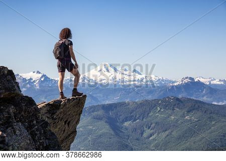 Adventurous Person Hiking In The Canadian Mountains During A Sunny Summer Morning. Taken On The Trai