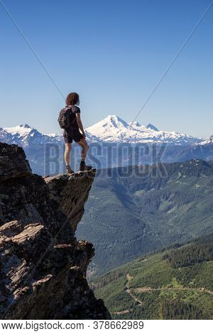 Adventurous Person Hiking In The Canadian Mountains During A Sunny Summer Morning. Taken On The Trai