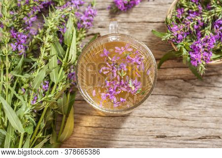 Fireweed Is A Healthy Herbal Tea. Mug Of Traditional Russian Drink Ivan Tea On A Wooden Background W