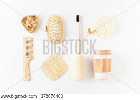 Reusable Eco Friendly Items On White Surface. Bamboo Toothbrush, Detangling Hair Brush, Coffee Mug, 
