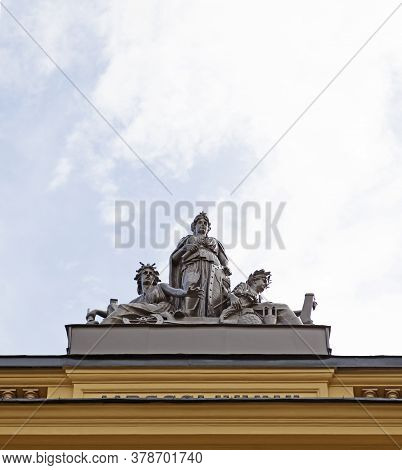 Sundsvall, Norrland Sweden - July 14, 2020: Statues With Antique Motifs On The Roof Of An Old Stone 