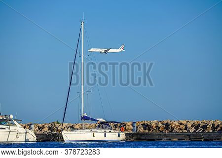 Cagnes- Sur-mer, France 24.07.2020. Flying Plane Over The Sea With Yachts. High Quality Photo