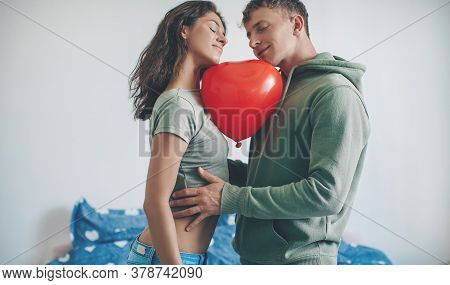 The Happy Couple Relax In The Bed. Red Haert. Valentine Day.