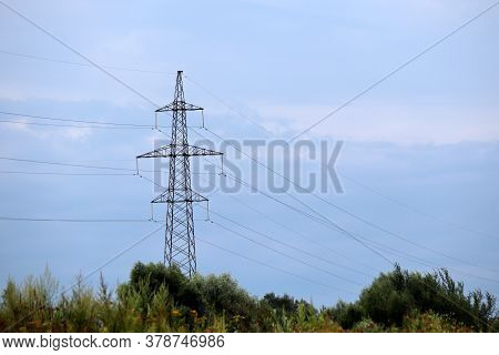 High Voltage Tower With Electrical Wires In The Countryside. Electricity Transmission Lines, Electri
