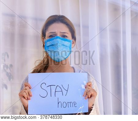 Young Woman In Medical Mask Stay Isolation At Home For Self Quarantine. Concept Home Quarantine, Pre