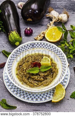Eggplant Dip Baba Ganoush (mutabbal) Or Mezze With Ripe Vegetables And Fresh Herbs