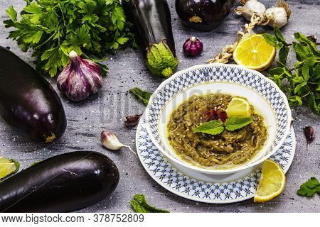 Eggplant Dip Baba Ganoush (mutabbal) Or Mezze With Ripe Vegetables And Fresh Herbs