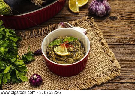 Eggplant Dip Baba Ganoush (mutabbal) Or Mezze With Ripe Vegetables And Fresh Herbs