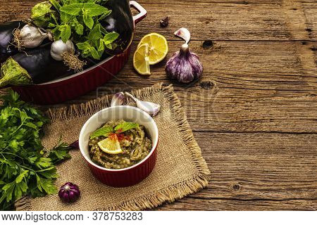 Eggplant Dip Baba Ganoush (mutabbal) Or Mezze With Ripe Vegetables And Fresh Herbs