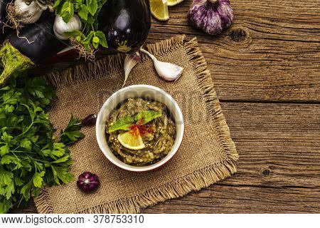Eggplant Dip Baba Ganoush (mutabbal) Or Mezze With Ripe Vegetables And Fresh Herbs