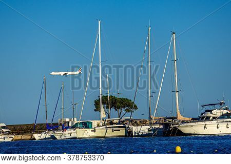 Cagnes- Sur-mer, France 24.07.2020. Flying Plane Over The Sea With Yachts. High Quality Photo