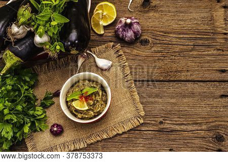 Eggplant Dip Baba Ganoush (mutabbal) Or Mezze With Ripe Vegetables And Fresh Herbs