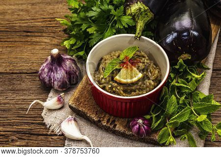 Eggplant Dip Baba Ganoush (mutabbal) Or Mezze With Ripe Vegetables And Fresh Herbs