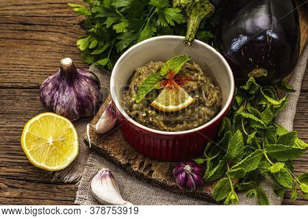 Eggplant Dip Baba Ganoush (mutabbal) Or Mezze With Ripe Vegetables And Fresh Herbs