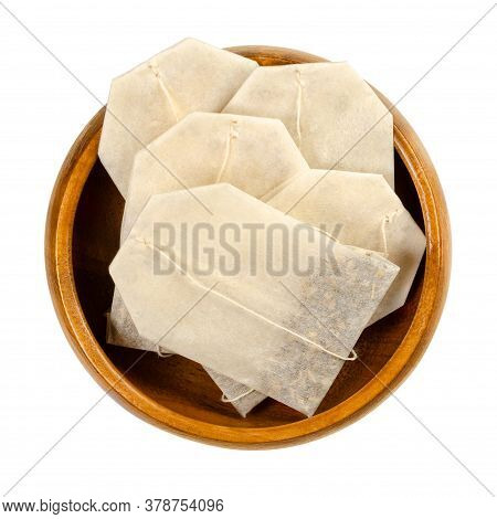 Tea Bags In Wooden Bowl. Small, Porous, Sealed Bag, Made Of Filter Paper, With Attached String, Cont