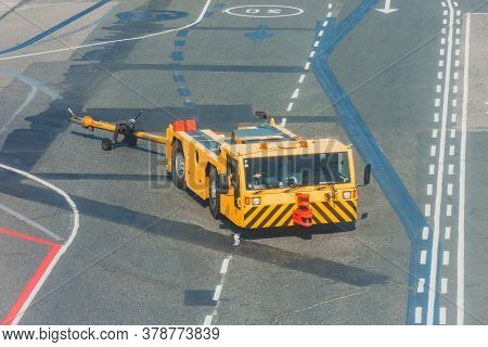 Tow Truck Vehicles Trailer For Puch Back Plane At The Airfield