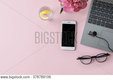 Podcast Recording, Microphone, Laptop, Phone, Water With Lemon And Glasses On A Pink Background With
