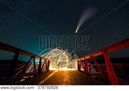 Long Exposure Of Spinning Steel Wool In Abstract Circle Making Firework Showers Of Yellow Glowing Sp