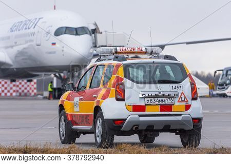 Follow Me Car Renault Duster Rolf Meets An Airplane Airbus A-350 Aeroflot Airlines In The Background