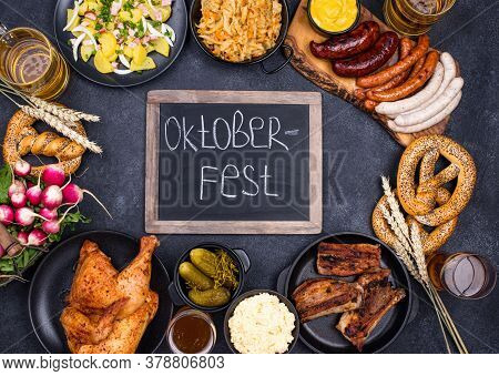 Oktoberfest Dishes: Beer, Pretzel, Sausage, Stewed Cabbage, Potato Salad Half Of Chicken And Ribs