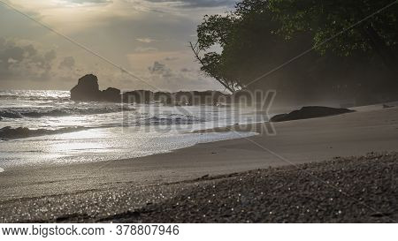 Africa's Gold Coast In Silhouette And Haze From The Sea That Is Common Towards Evening During Sunset